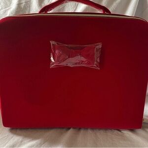 Red velvet Estée Lauder travel makeup bag